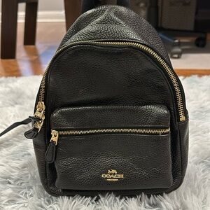 Black Coach mini book bag with gold zippers